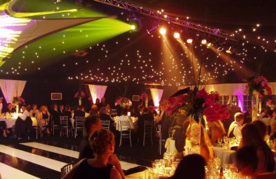 40th Private Party in a marquee design with black & white dance floor, silver chairs, orchid centre pieces and party lightning