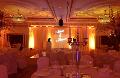 Elegant and soft wedding decor with golden candelabras, soft lightning and white theme