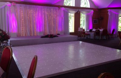 white dance floor and stage rental for events