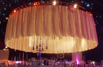 Oversized Fabric Chandelier with white drapery rental for a corporate management styling
